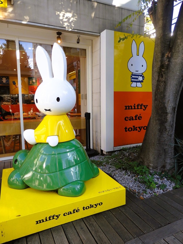 The charming exterior of miffy cafe tokyo, featuring a Miffy statue riding a turtle.