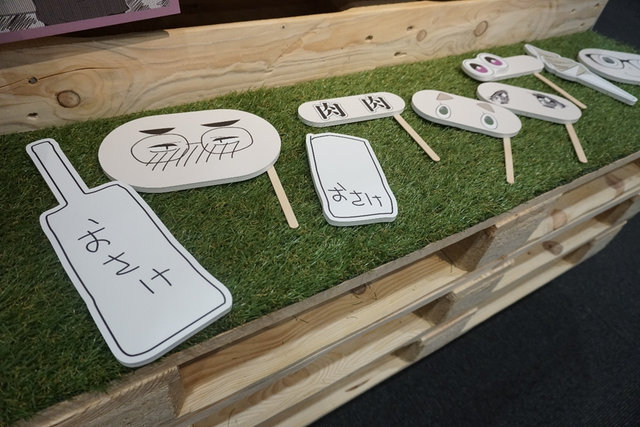 Funny faces photo prop corner at the Yuru Camp exhibition.