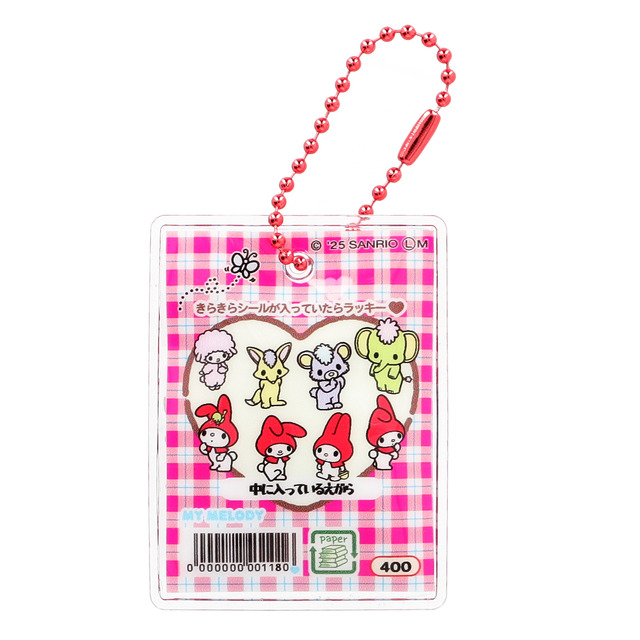 Back view of the charm showing the heart-shaped window and design details